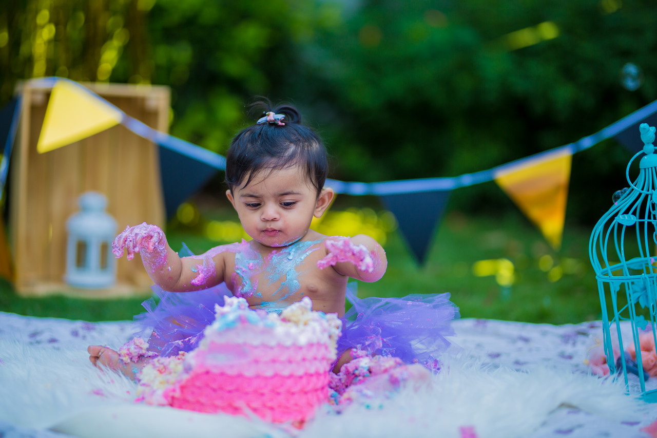 Cake smash photographer UK — pure joy, South Indian first birthday celebration