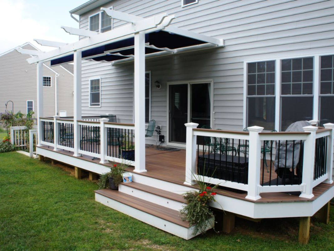 Composite deck with built-in seating and planters