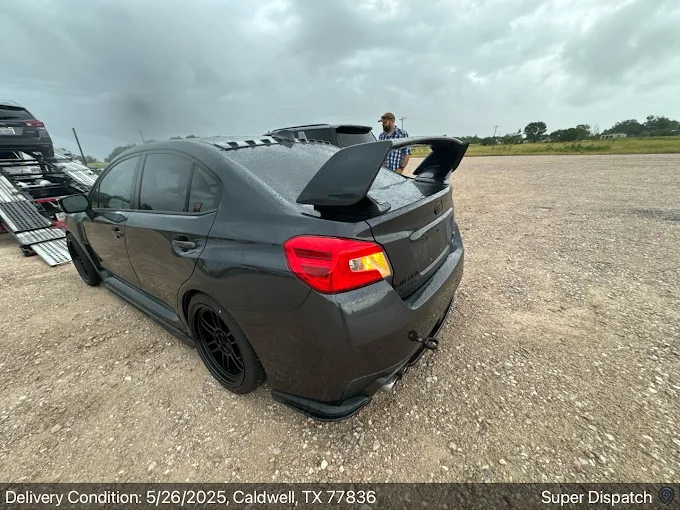 Vehicle being unloaded at destination