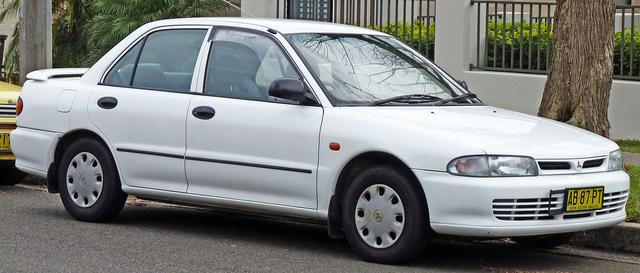 1280px-1993-1996-Mitsubishi-Lancer-CC-Executive-sedan-01.jpg