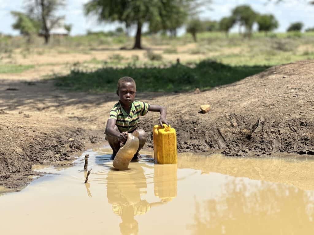 Child collecting water