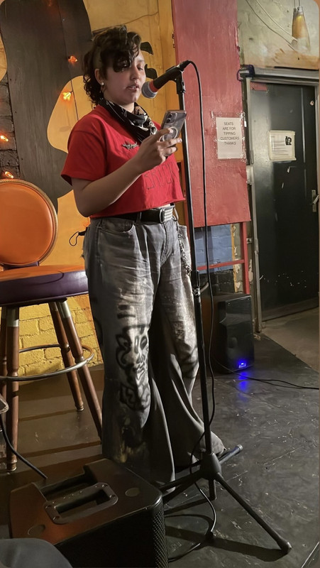 Photo of me reading on stage