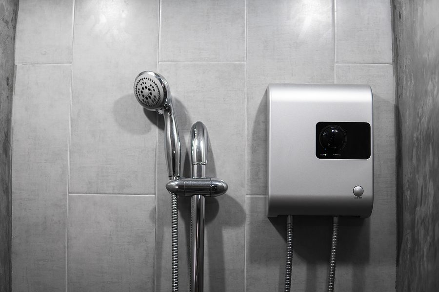 Albuquerque licensed plumber performing tankless water heater maintenance and flushing