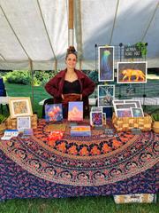 Wenna at a stall with artworks
