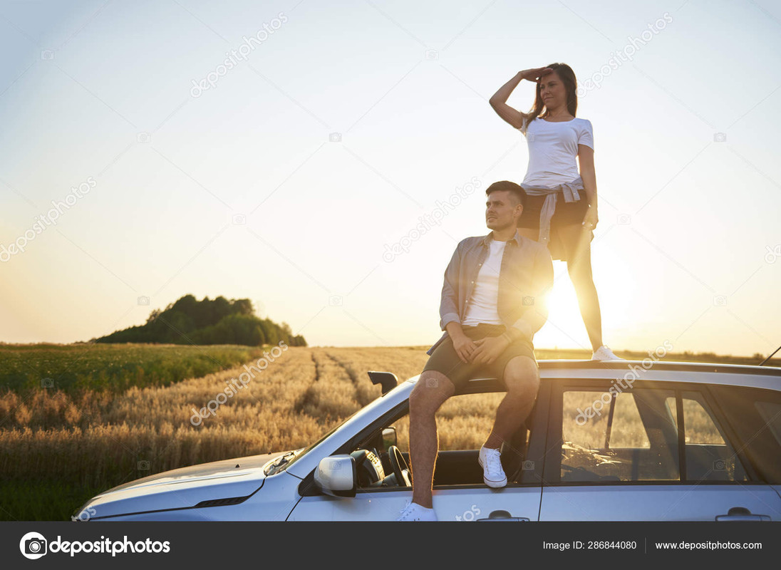 depositphotos-286844080-stock-photo-young-couple-sitting-car.jpg