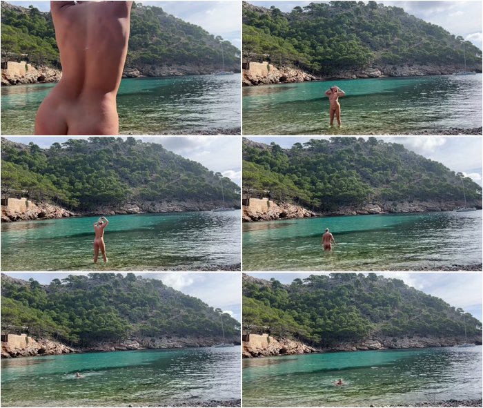 girl-swimming-on-a-public-beach-completely-naked-3.jpg