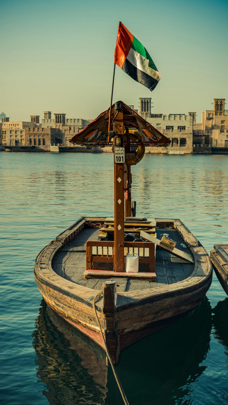 A boat on the river carrying the UAE flag