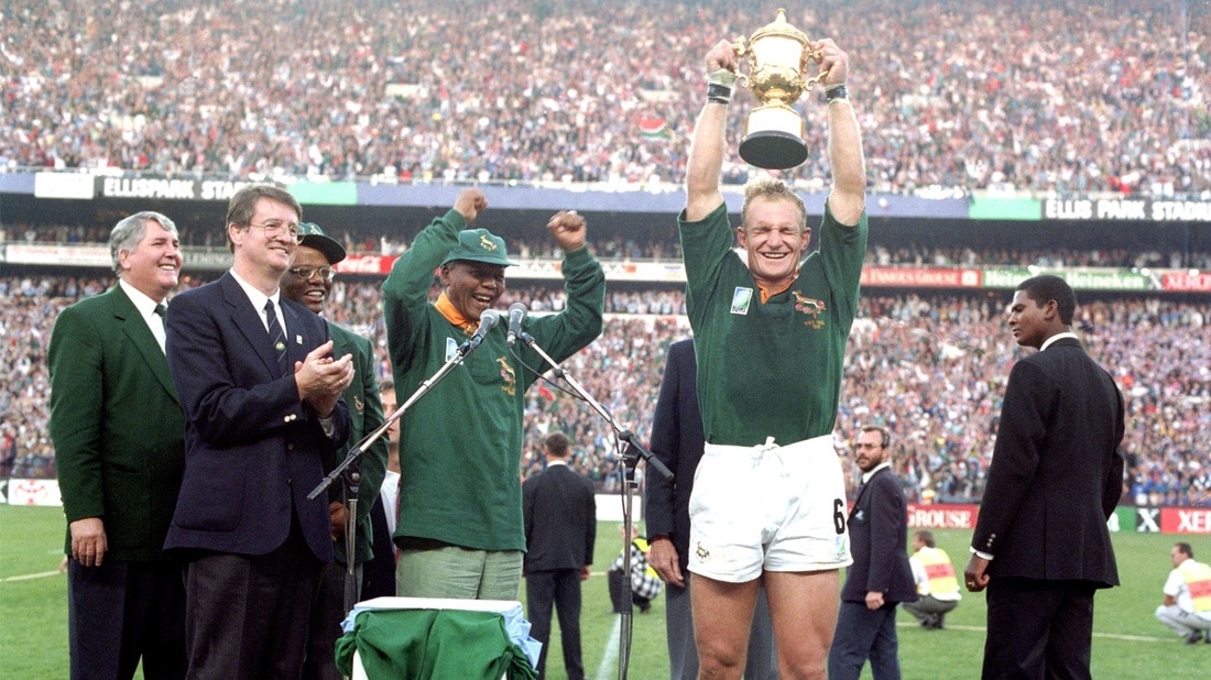 Mr Mandela celebrating the win of the rugby world cup by his coutry in 1995