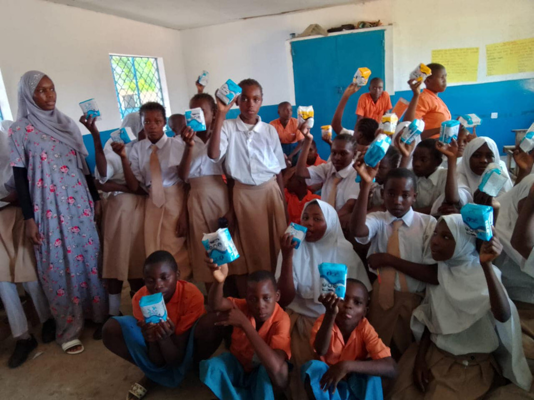 Young Girls Holding Sanitary Pads