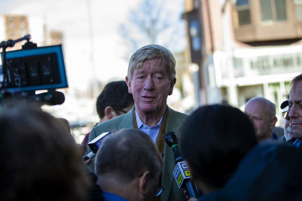 William Weld talking with reporters in Iowa