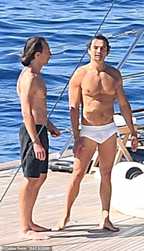61615845-11135095-Figure-He-showed-off-his-muscular-frame-as-he-went-shirtless-dur-m-144-16611892310.jpg