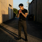 Man-lighting-cigarette-in-alley-202605131457-1