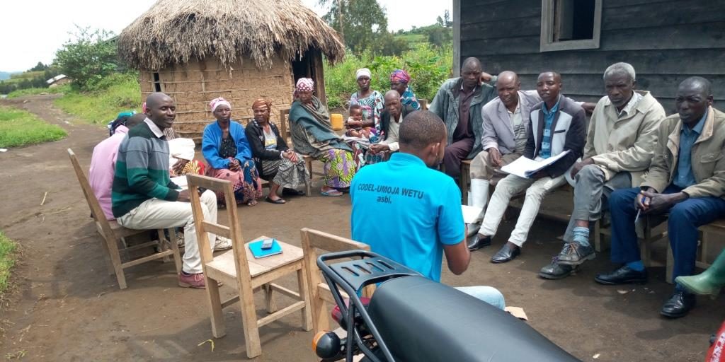 Whitney leaning against a railing on a downtown street
                    