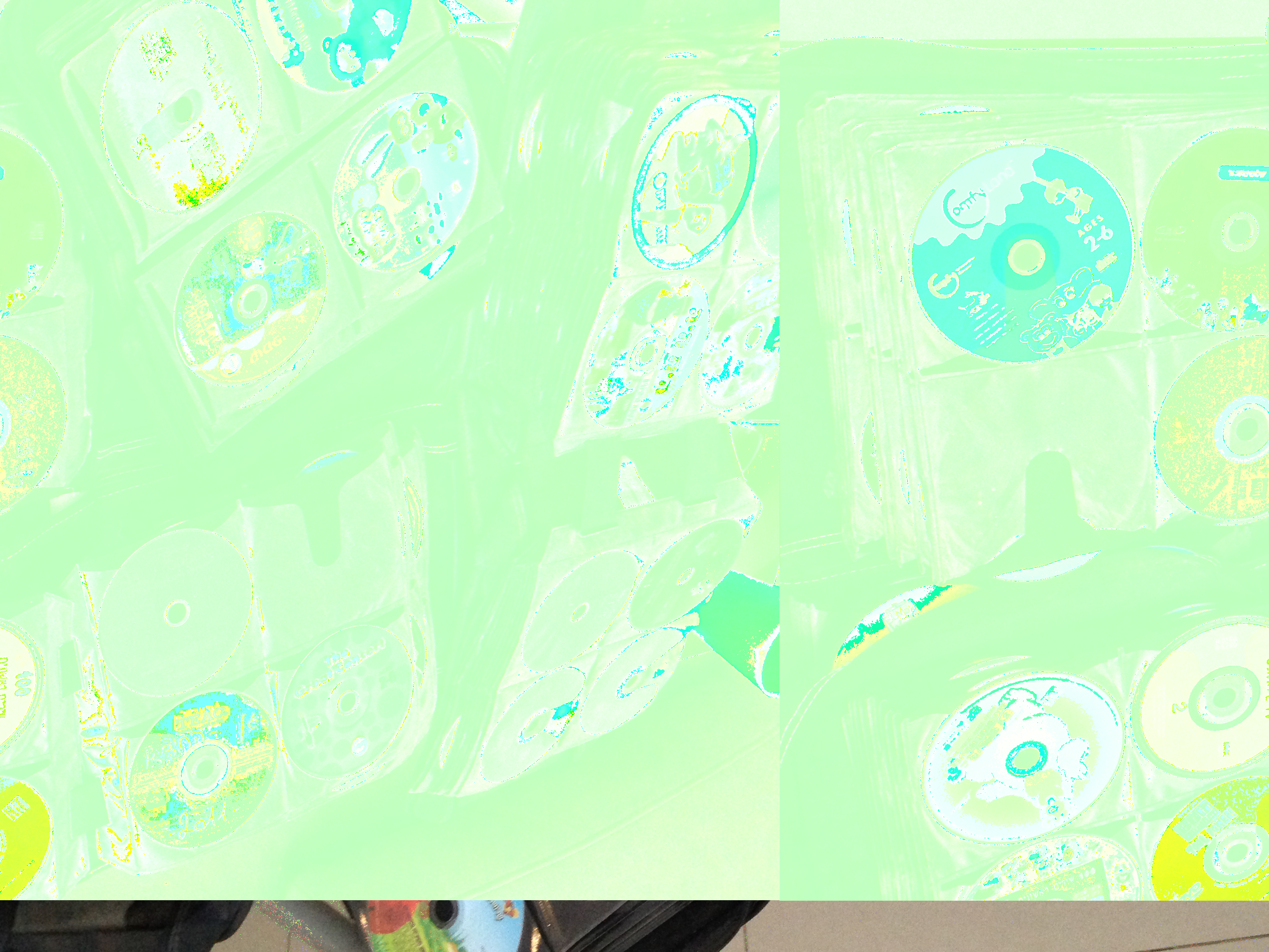 a datamoshed image of CD binders