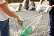 children-collects-garbage-in-garbage-bags-in-park-Q5VGGXP