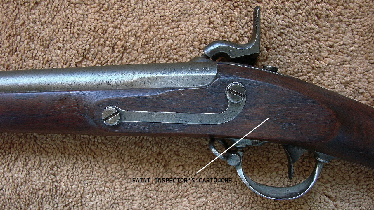 Faint cartouches on stock