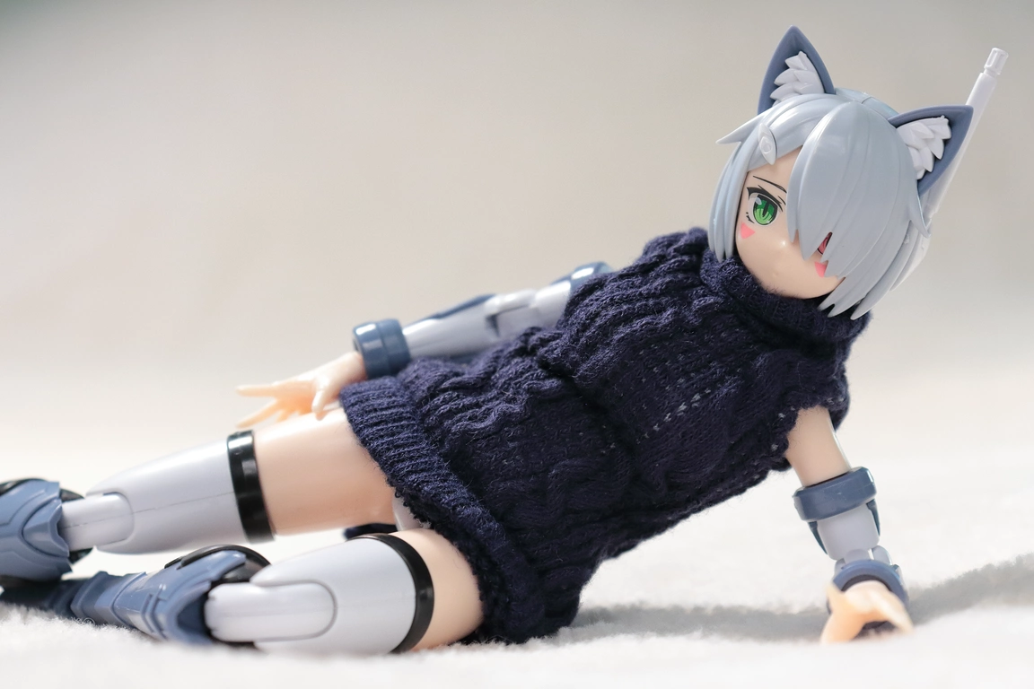 A front view of “Variable Fighter Girls” Kairos girl wearing a 1/12 Turtle Knit One-piece Dress in navy