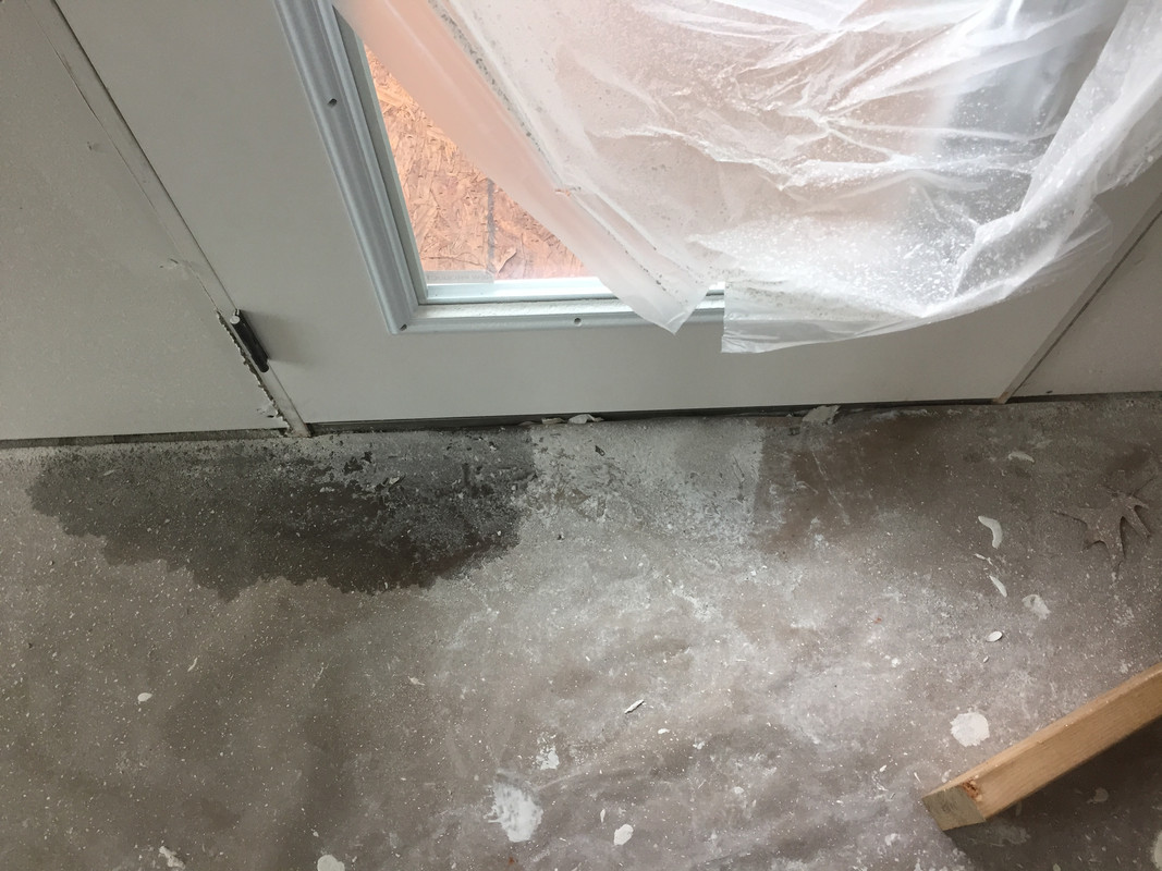 Why is this door leaking? (New construction) EDIT New pics
