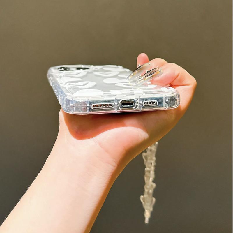 Foto de Funda transparente con diseño corazón. Incluye correa de mano.