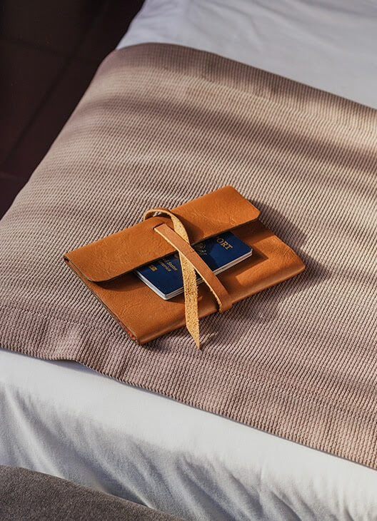 a passport on a bed
