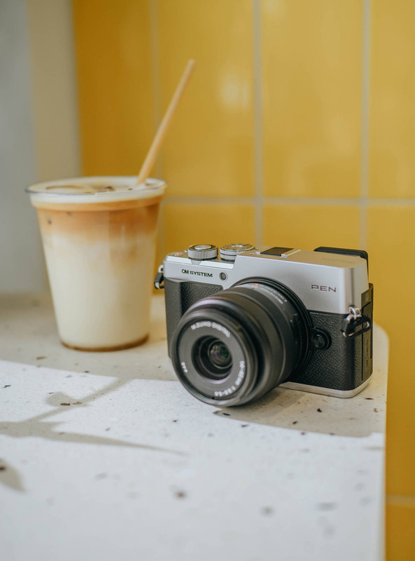 OM SYSTEM PEN Mirrorless Camera lifestyle shot