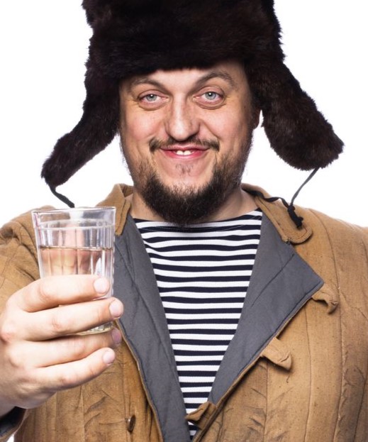 happy-russian-man-offering-a-vodka-cheer