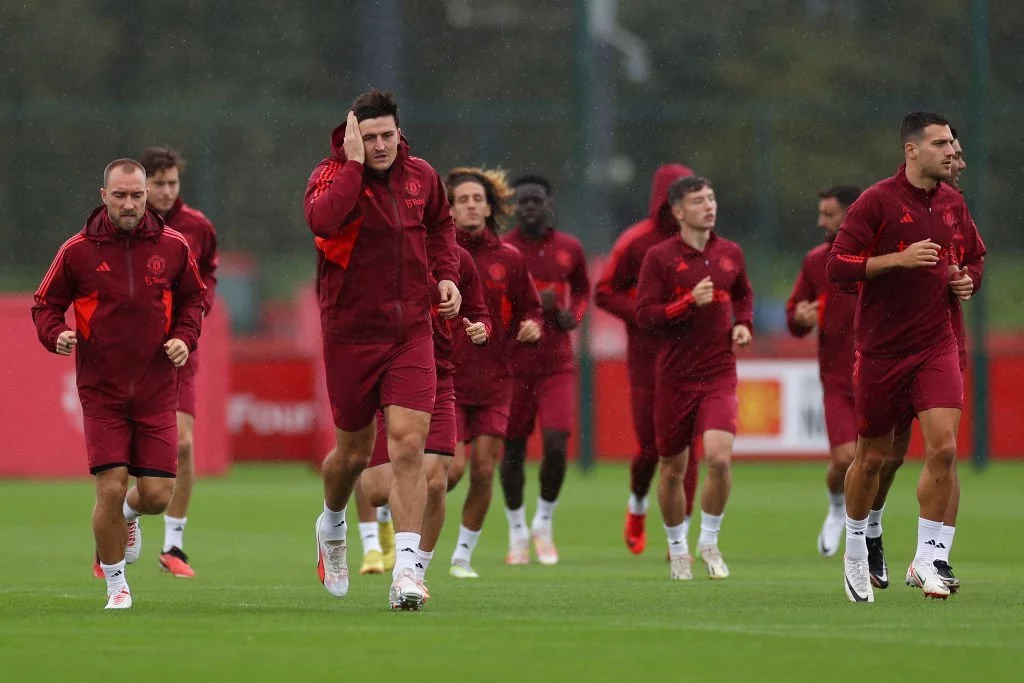 Harry Maguire of Manchester United warms up during a Manchester United Training Session at Carrington Training Ground