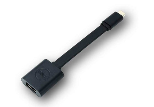 Una persona conectando un adaptador Dell a una laptop.
