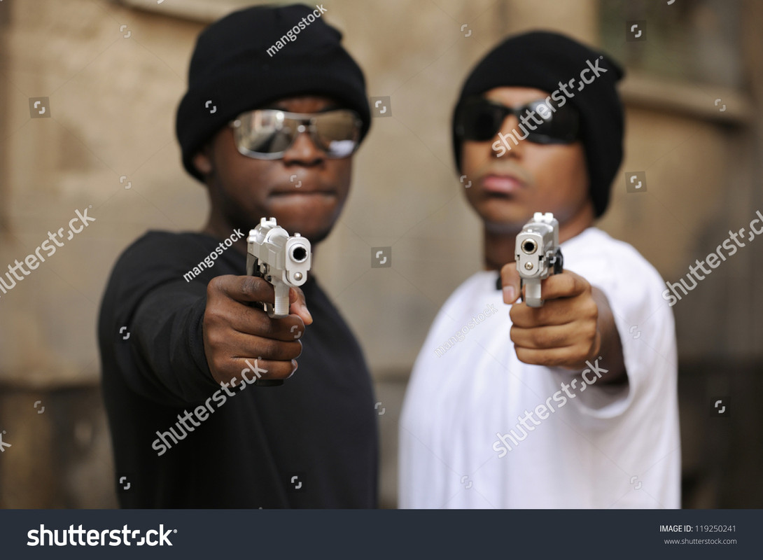 stock-photo-gang-members-on-the-street-focus-on-guns-119250241