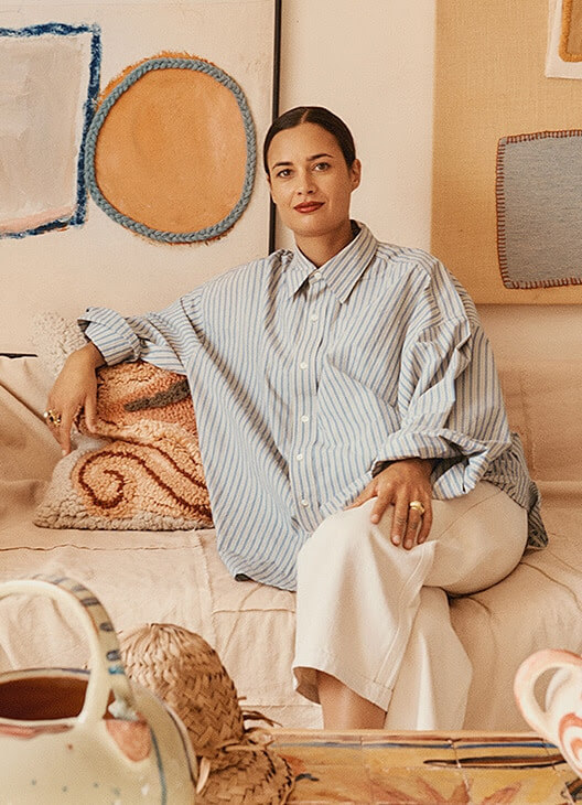 a woman sitting on a couch