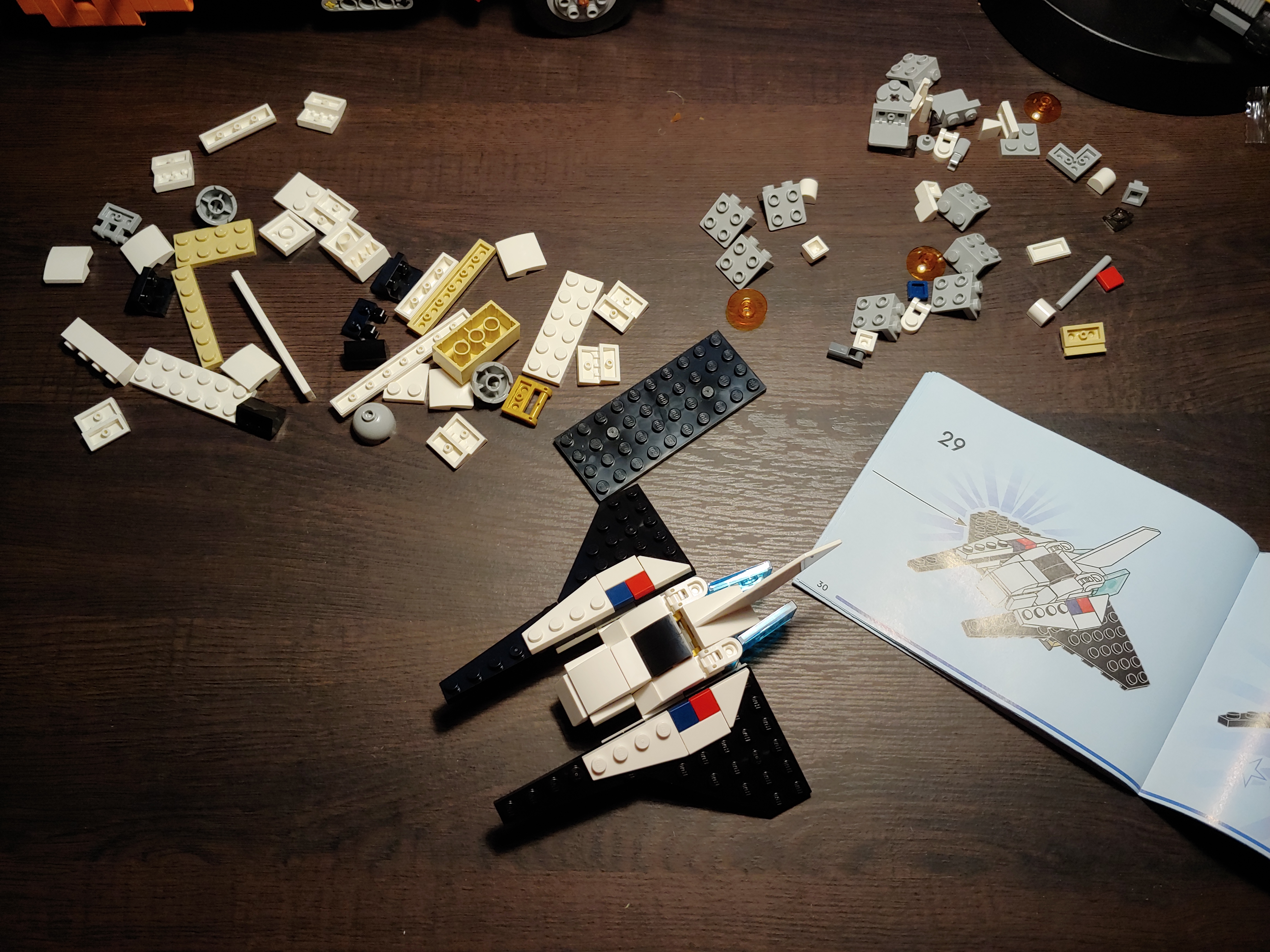 The assembled spaceship, surrounded by unused parts.
