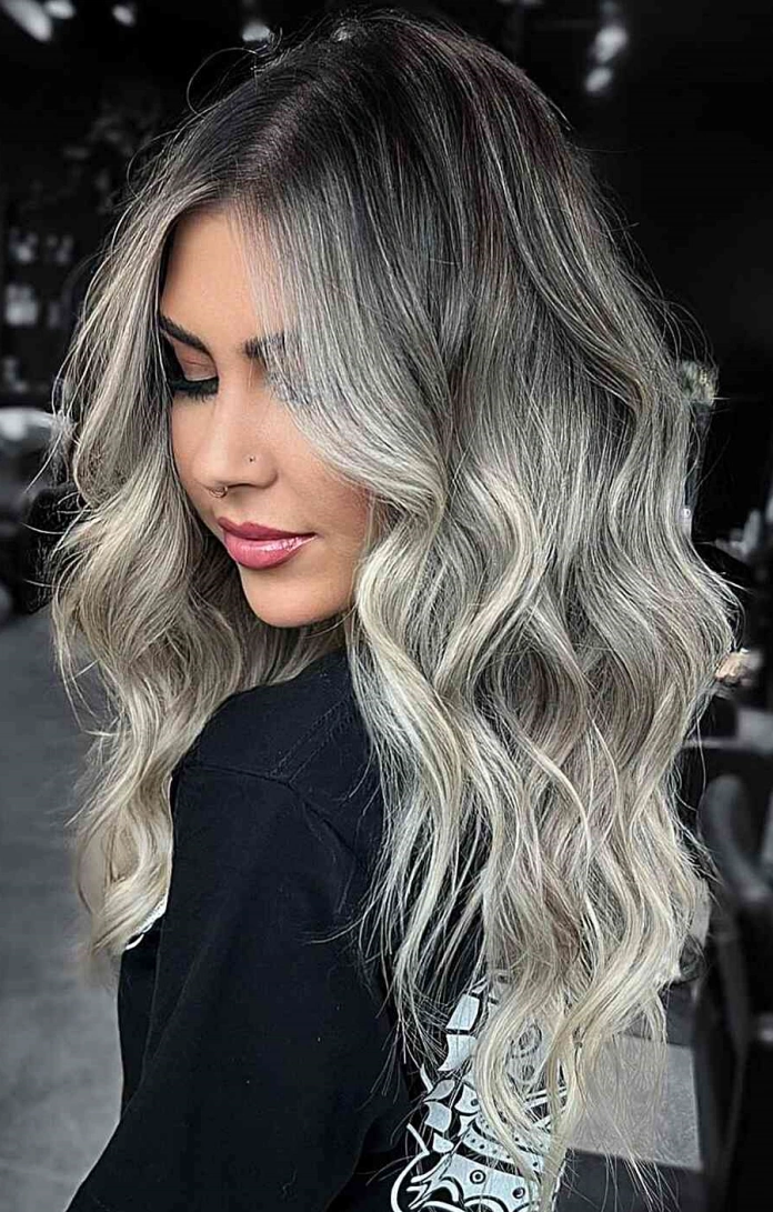 Dark rooted hair with icy platinum blonde highlights