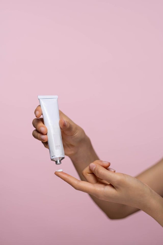 a woman's hands holding steroids cream