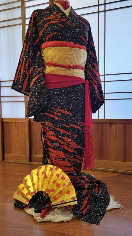 Japanese kimono for dancing. Black with red clouds, gold obi, red accessories.