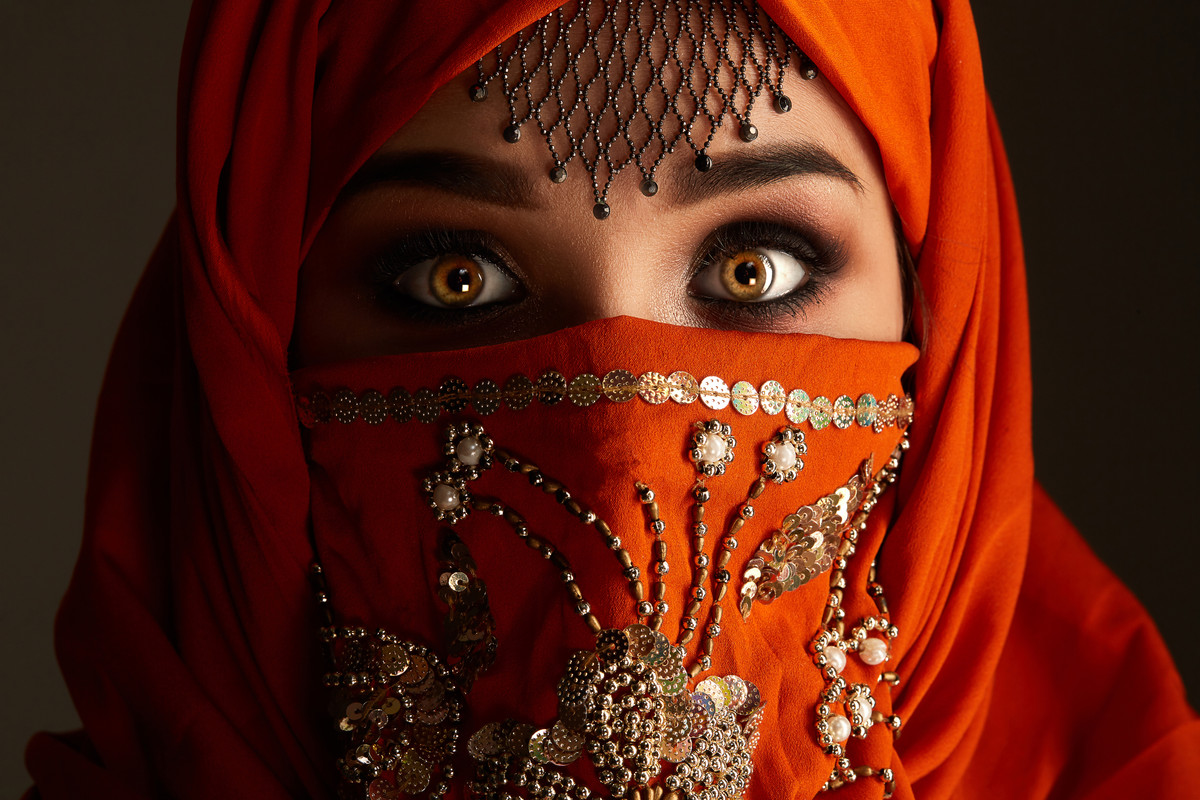 C:\Users\lenovo\Pictures\Saved Pictures\muslim woman\close-up-portrait-scared-young-girl-with-smoky-eyes-jewelry-forehead-wearing-terracotta-hijab-decorated-with-sequins-she-is-looking-camera-dark-background-human-emot.jpg