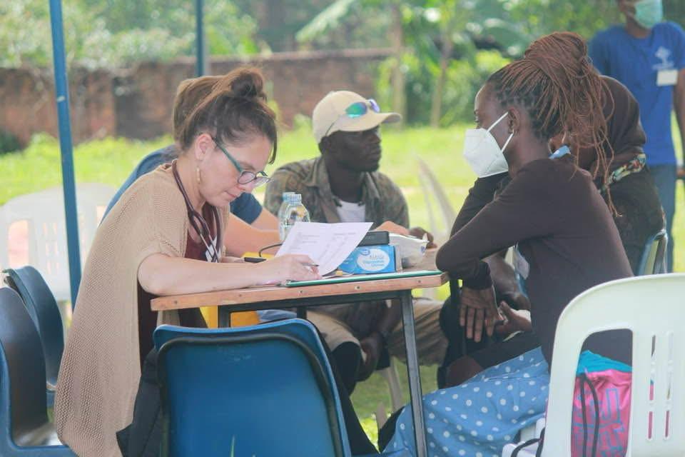 International and Ugandan healthcare workers serving side by side