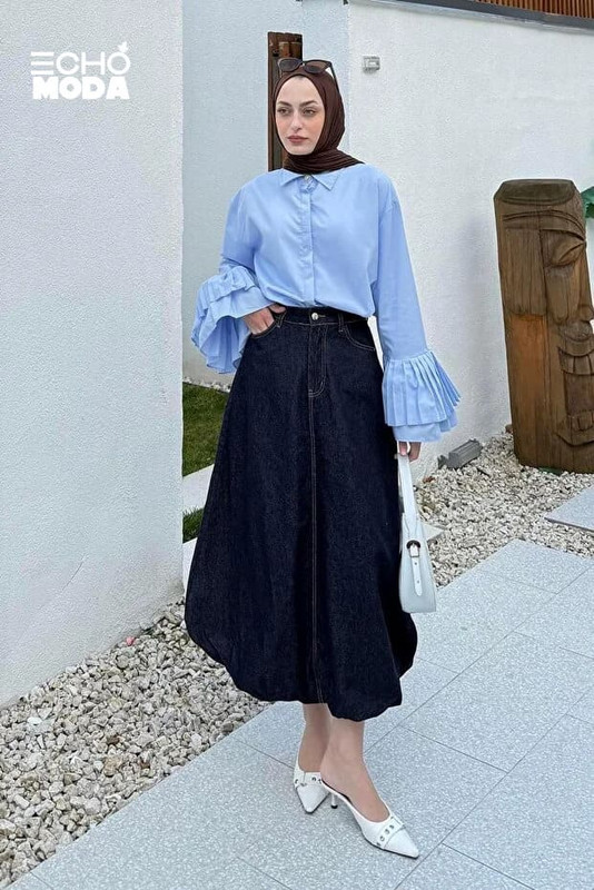 بلوزة طويلة بستايل رسمي يمكن ارتداؤها مع جيبة سوداء لإطلالة أنيقة في العمل. بلوزة طويلة بستايل رسمي يمكن ارتداؤها مع جيبة سوداء لإطلالة أنيقة في العمل.