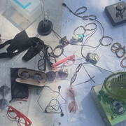 a clutter of glasses on a white sheet