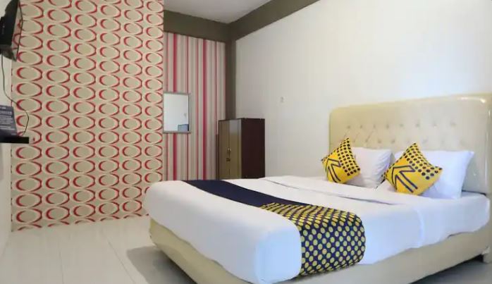 Kamar penginapan di SPOT ON 1772 Hotel Penginapan Cemara Syariah