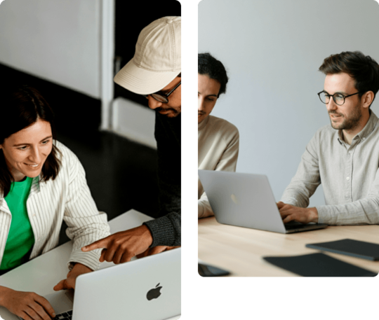 Två kollegor som samarbetar vid sina laptops i en modern kontorsmiljö – hero-bild för AI Business School.