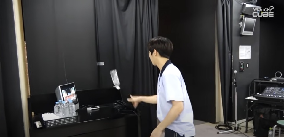 Minhyuk's water bottle flipping