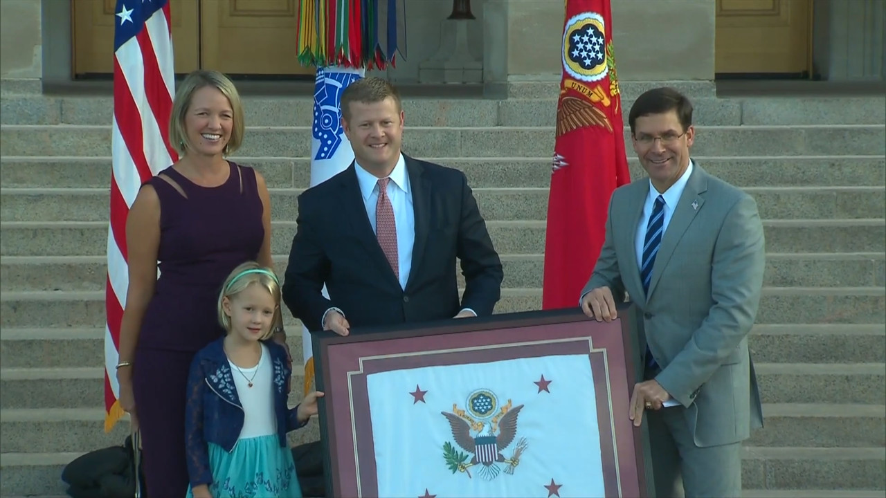 Ryan McCarthy receiving US Army Leadership Award with his family