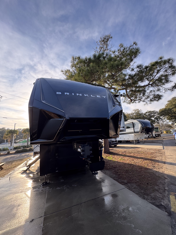 Close view of a black Cobalt bow holding a sharp reflection across the freshly polished gelcoat