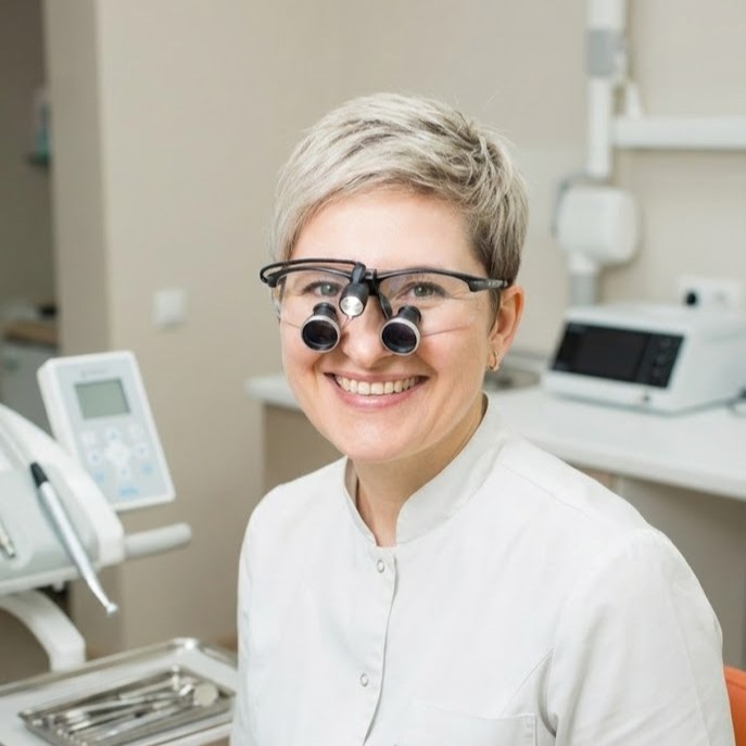 Работа стоматолога под увеличением