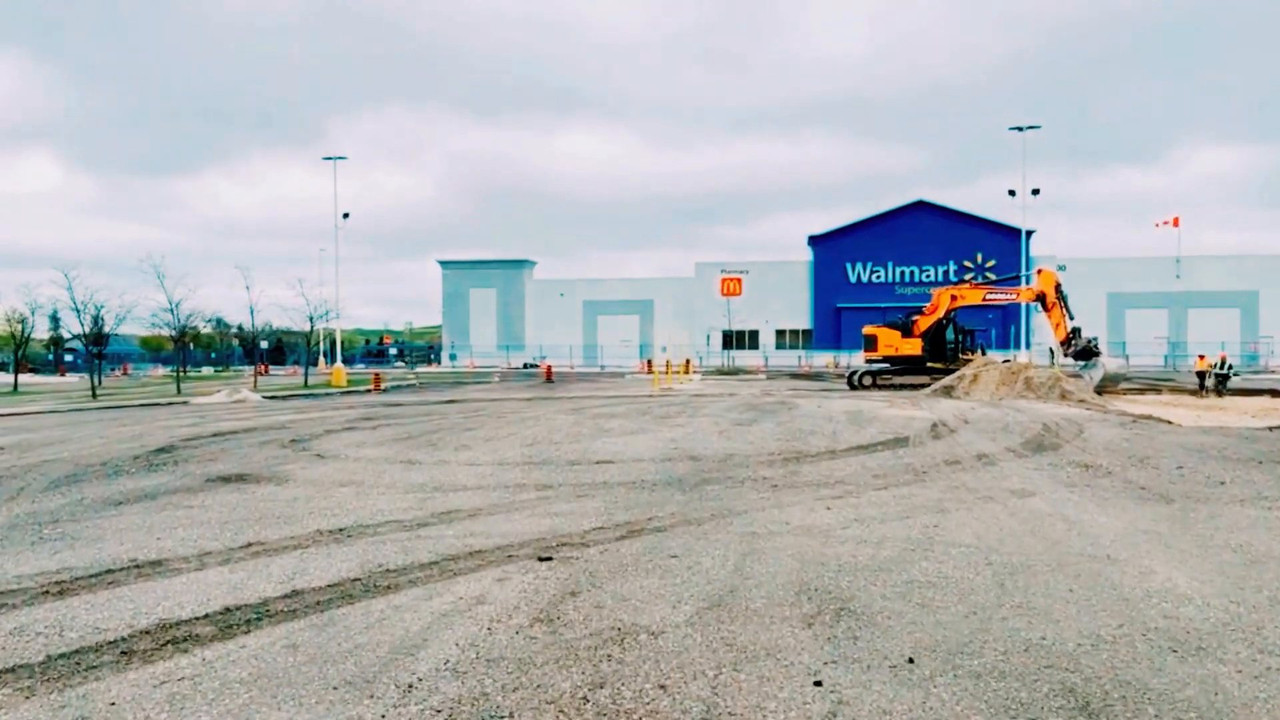 HKC excavator rebuilding the parking lot in front of the Walmart Heartland Supercentre in Mississauga