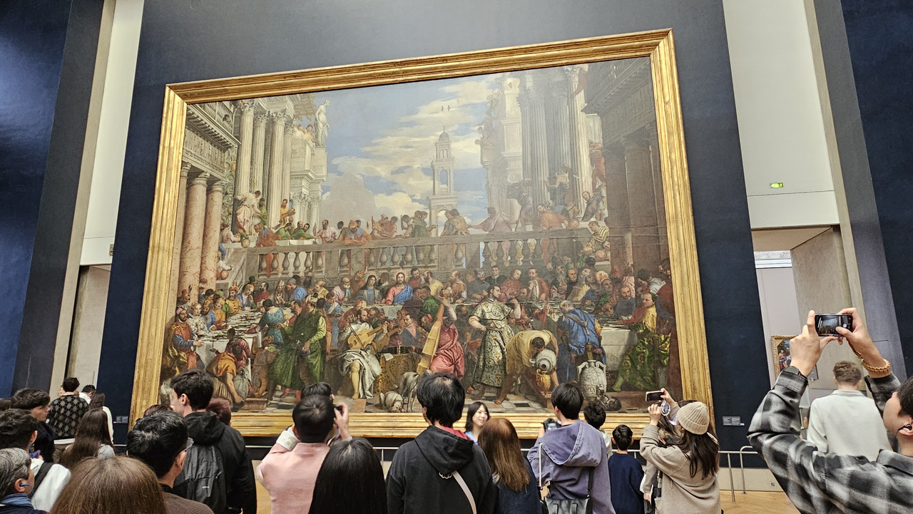 《迦納的婚禮》(法語:Les Noces de Cana),聽說畫作中有五條狗,但我怎麼找都只找到四條