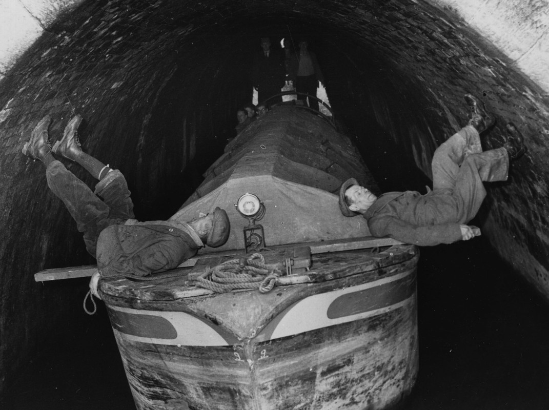 Legging through canal tunnel