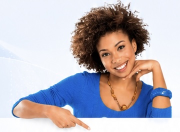 Smiling businesswoman pointing toward contact form