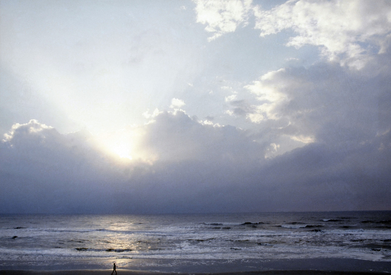 Man Walking on Beach