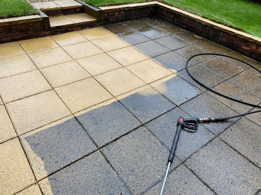 A freshly pressure washed and cleaned patio area